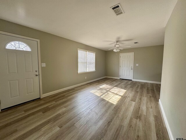 entryway featuring ceiling fan and light hardwood / wood-style flooring