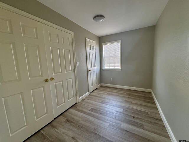 unfurnished bedroom with light hardwood / wood-style flooring