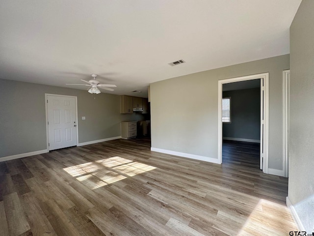 unfurnished living room with ceiling fan and light hardwood / wood-style floors