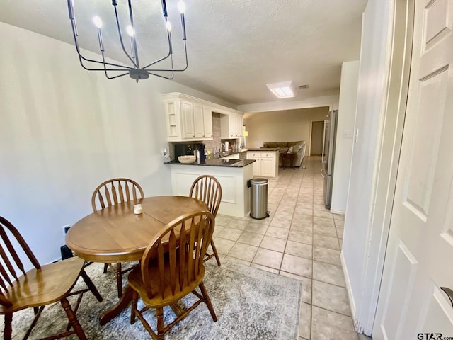 403 Aspen Bend St, Crockett, TX 75835 - dining room featuring light tile patterned floors, a chandelier, and a textured ceiling