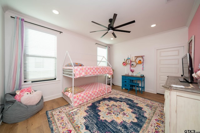 bedroom with ceiling fan, light hardwood / wood-style flooring, and crown molding