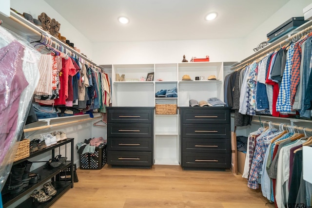 walk in closet featuring light hardwood / wood-style flooring