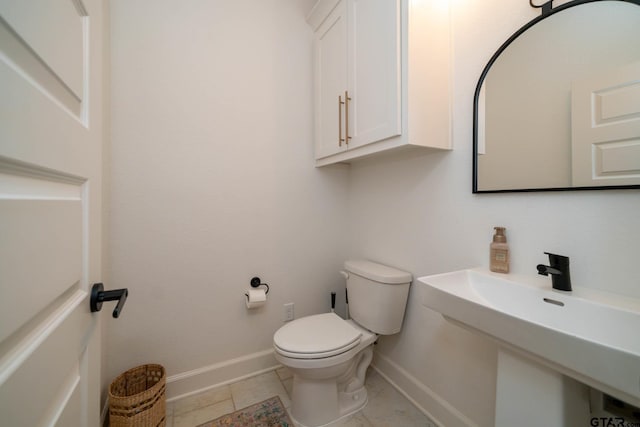 bathroom with toilet and sink