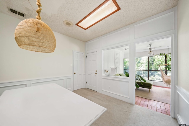 carpeted bedroom with a textured ceiling