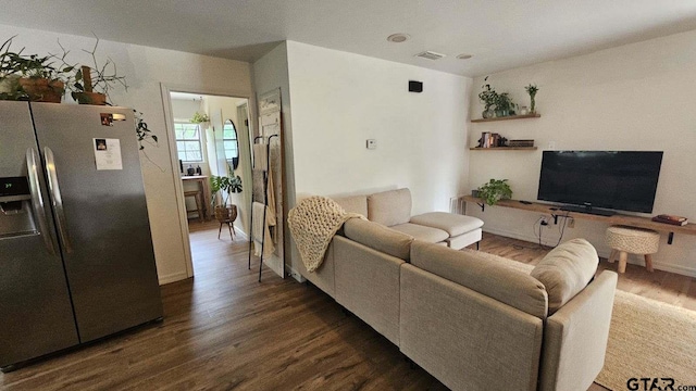 living room featuring dark wood-type flooring