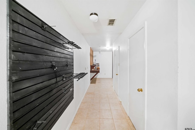 corridor with light tile patterned flooring