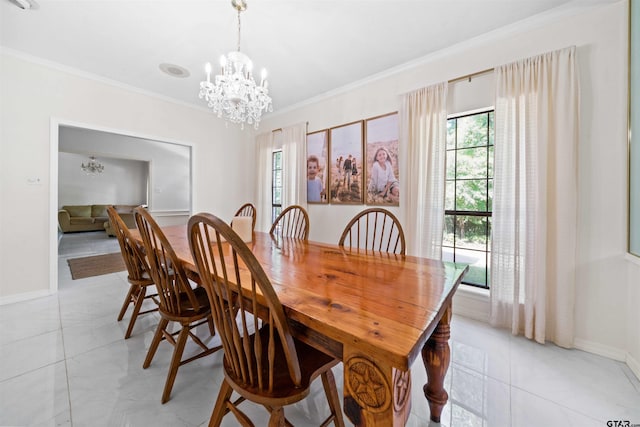 tiled dining room featuring ornamental molding and a chandelier