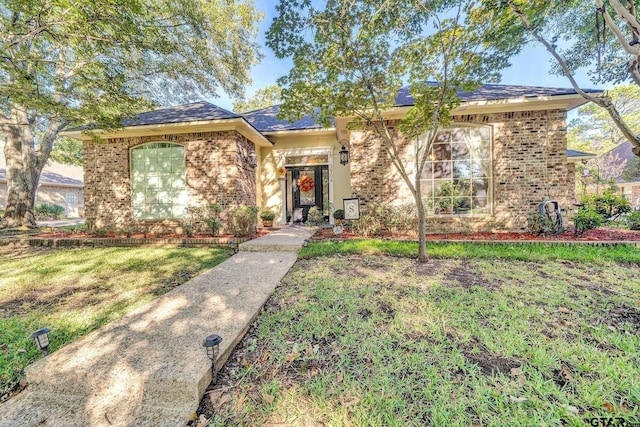 ranch-style house with a front lawn