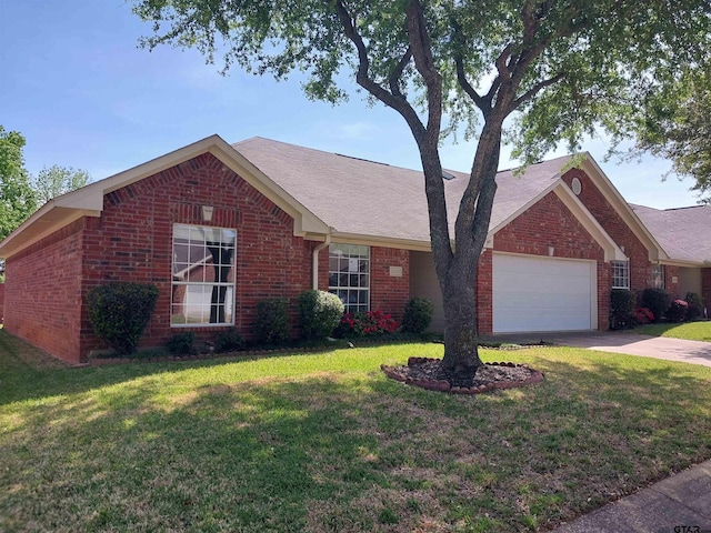 ranch-style home featuring a garage and a front lawn