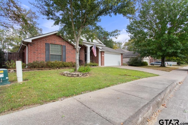 view of front of house featuring a garage and a front yard