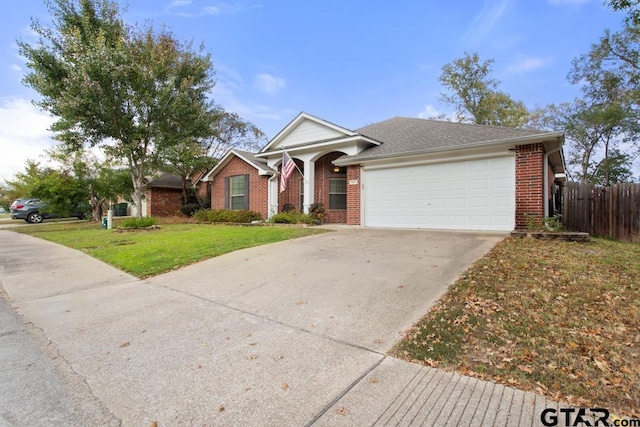 view of front of home with a garage and a front yard