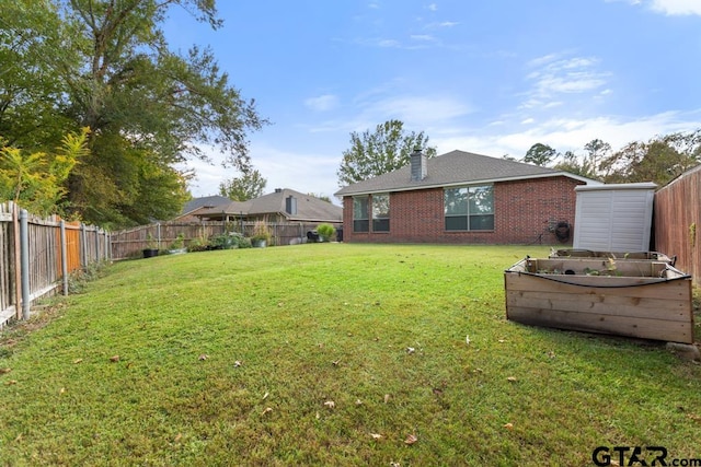 view of yard with a storage shed