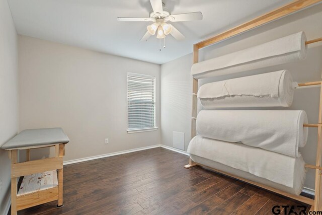 bedroom with dark wood-type flooring and ceiling fan