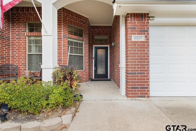 property entrance with a garage