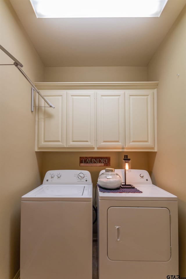 8416 Crooked Trl, Tyler, TX 75703 - laundry area with cabinet space and washer and clothes dryer