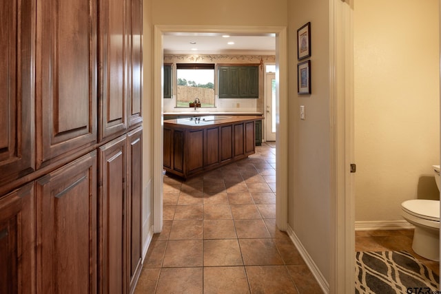 hallway with light tile patterned floors