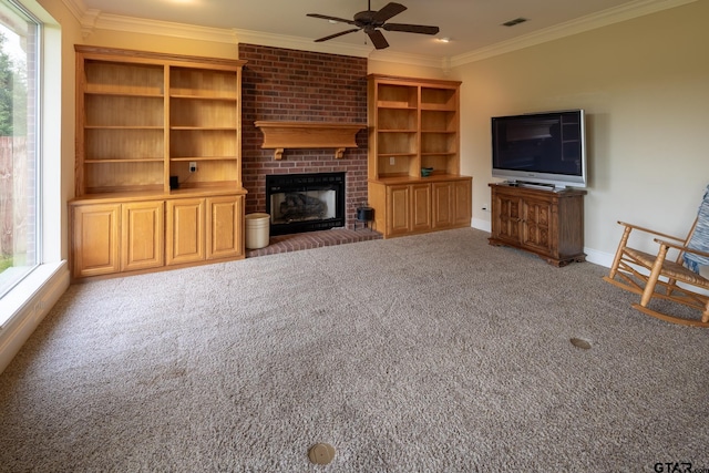 unfurnished living room with a fireplace, ceiling fan, ornamental molding, and carpet