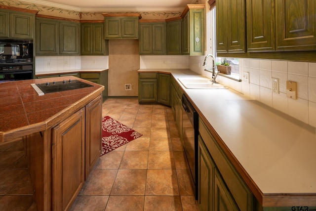 kitchen featuring black appliances, tasteful backsplash, crown molding, tile patterned floors, and sink