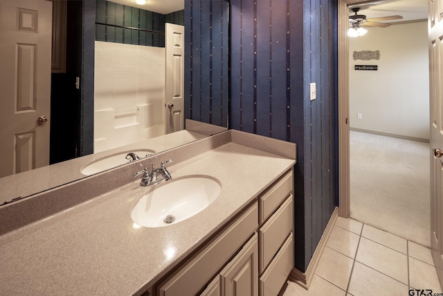 bathroom with tile patterned flooring, ceiling fan, and vanity