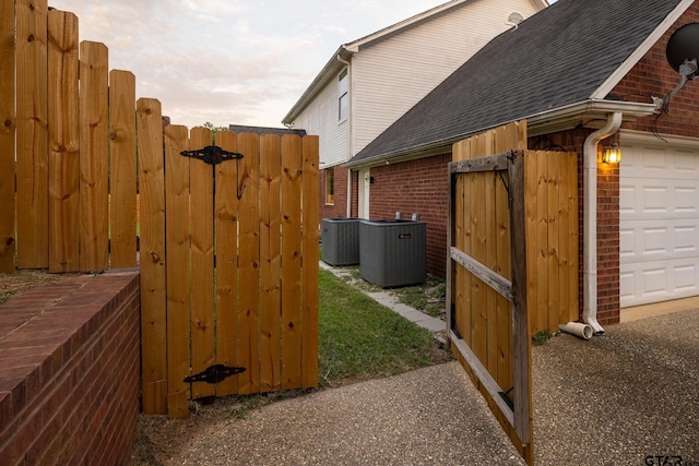 view of side of property featuring central AC