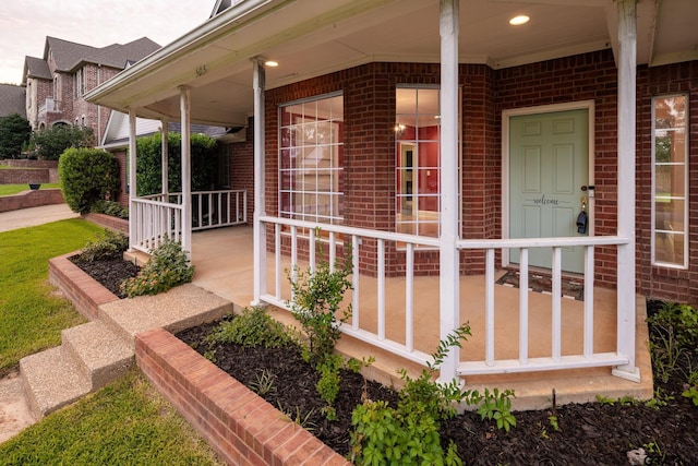 property entrance featuring a porch