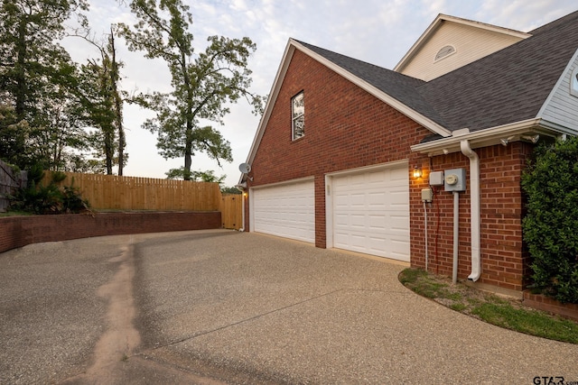 view of side of home with a garage