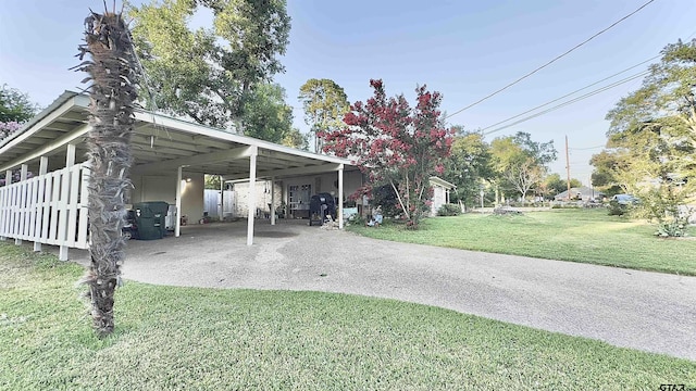 3004 Tower Dr, Tyler, TX 75701 - view of parking with driveway and an attached carport
