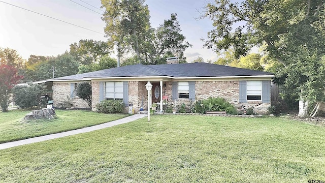 3004 Tower Dr, Tyler, TX 75701 - view of front of property featuring a front lawn and brick siding