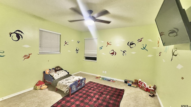 3004 Tower Dr, Tyler, TX 75701 - living area featuring carpet flooring, ceiling fan, and a textured ceiling