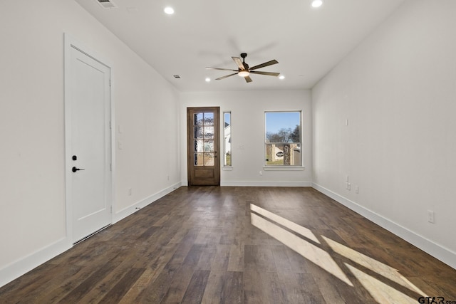 unfurnished living room featuring dark wood-style floors, baseboards, a ceiling fan, and recessed lighting