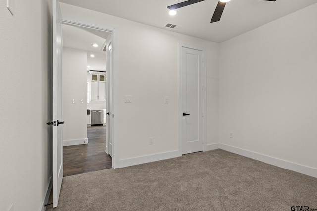 unfurnished bedroom with baseboards, visible vents, a ceiling fan, carpet flooring, and recessed lighting