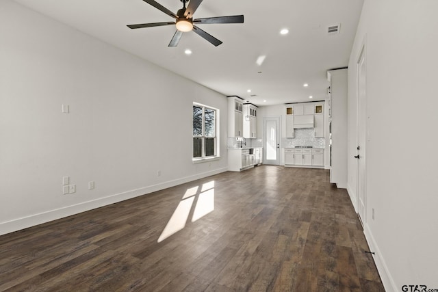 unfurnished living room featuring visible vents, dark wood finished floors, a ceiling fan, and recessed lighting