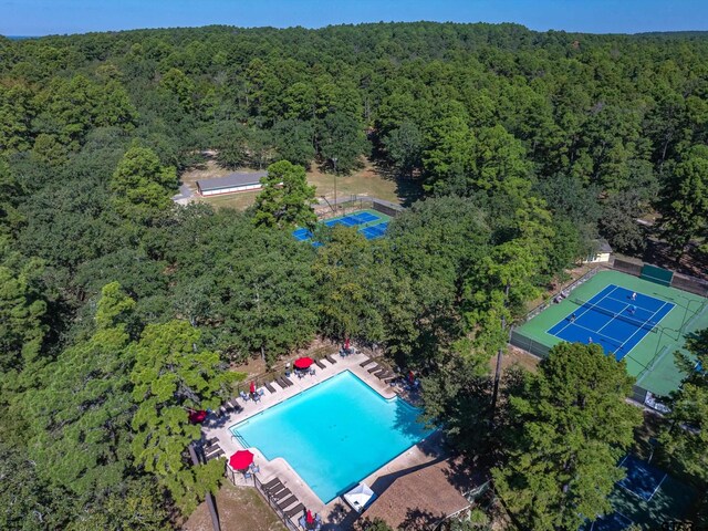 121 Rolling Rdg, Holly Lake Ranch, TX 75765 - aerial view of a forest and a pool area