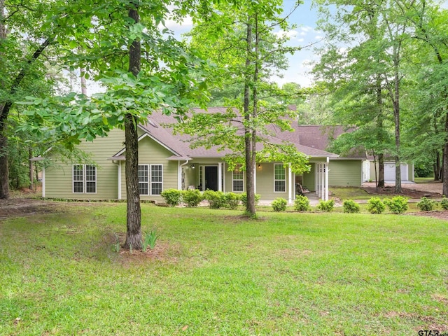 121 Rolling Rdg, Holly Lake Ranch, TX 75765 - view of front of property featuring a front yard, a chimney, roof with shingles, and a porch