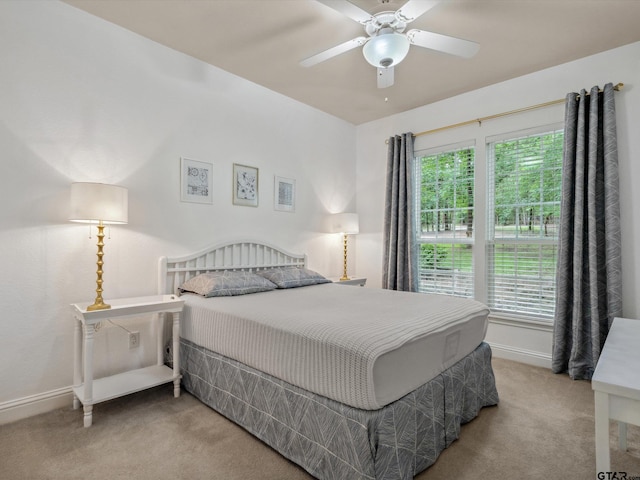 121 Rolling Rdg, Holly Lake Ranch, TX 75765 - carpeted bedroom featuring multiple windows, baseboards, and ceiling fan