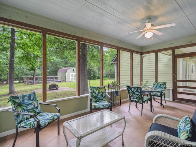 121 Rolling Rdg, Holly Lake Ranch, TX 75765 - sunroom featuring a ceiling fan, outdoor dining area, and plenty of natural light