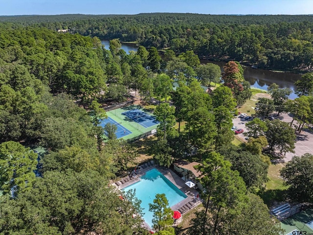 121 Rolling Rdg, Holly Lake Ranch, TX 75765 - aerial view of a forest, a large body of water, and a pool area