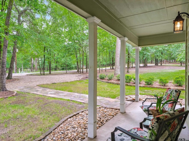 121 Rolling Rdg, Holly Lake Ranch, TX 75765 - view of patio / terrace featuring covered porch and view of scattered trees