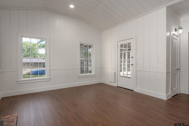 entryway with lofted ceiling, baseboards, and dark wood-type flooring