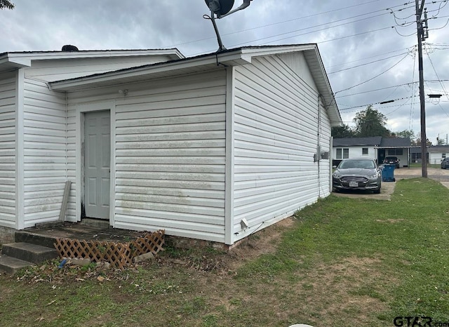 view of home's exterior with a yard