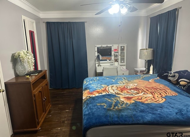 bedroom with dark wood-type flooring, ceiling fan, and crown molding