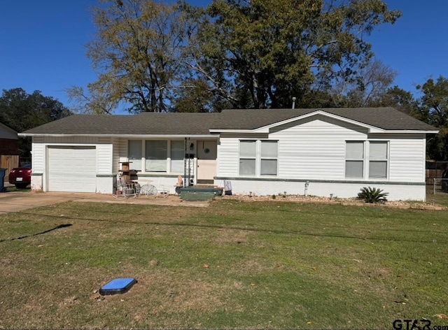 view of front of property featuring a garage and a front yard