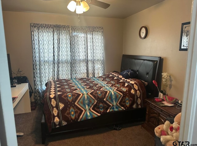 bedroom featuring ceiling fan and carpet floors