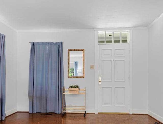 foyer entrance featuring ornamental molding and hardwood / wood-style flooring