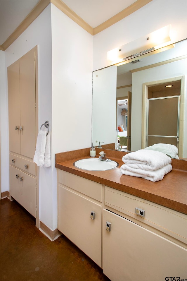 bathroom with concrete flooring, vanity, walk in shower, and ornamental molding