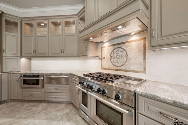 5581 Nancy Cir, Chandler, TX 75758 - kitchen with stainless steel appliances, custom exhaust hood, a warming drawer, backsplash, and glass insert cabinets