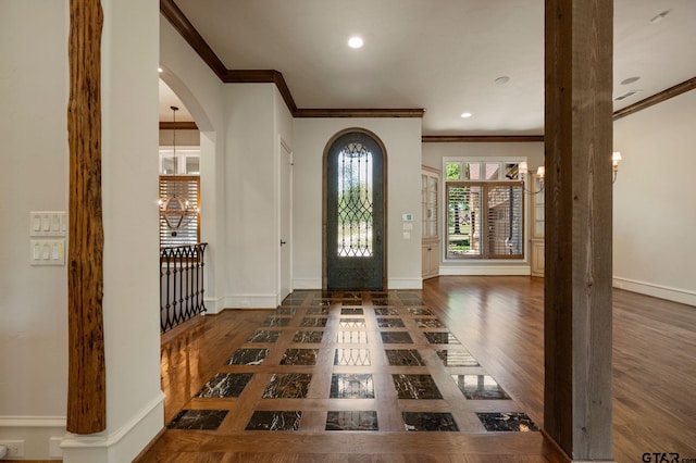 5581 Nancy Cir, Chandler, TX 75758 - entrance foyer featuring ornamental molding, wood finished floors, arched walkways, baseboards, and recessed lighting