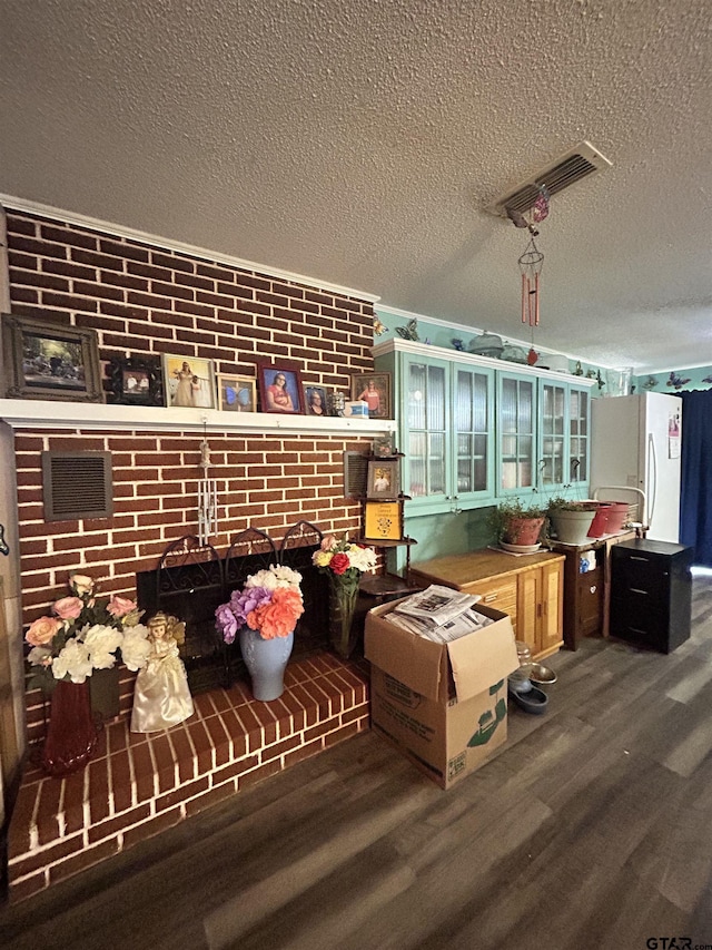 interior space featuring dark hardwood / wood-style flooring and a textured ceiling