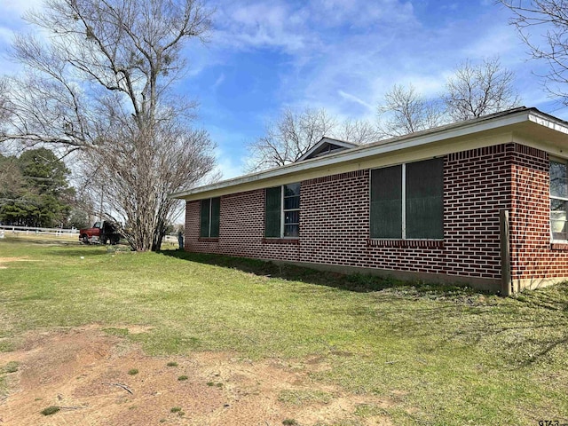 view of home's exterior featuring a yard