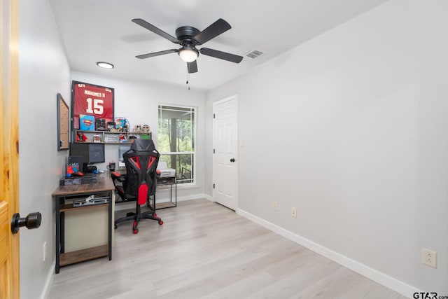 office with ceiling fan and light hardwood / wood-style floors